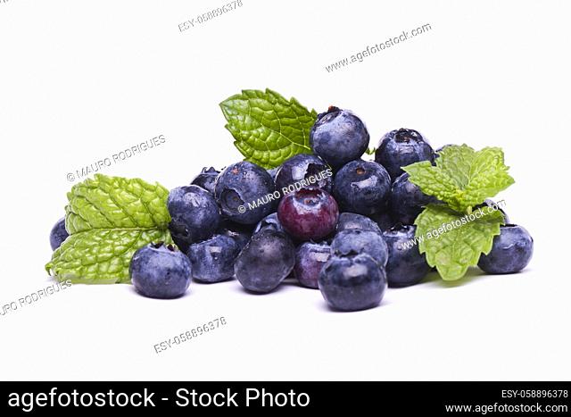 View of a bunch of tasty blueberries (Vaccinium myrtillus) isolated on a white background