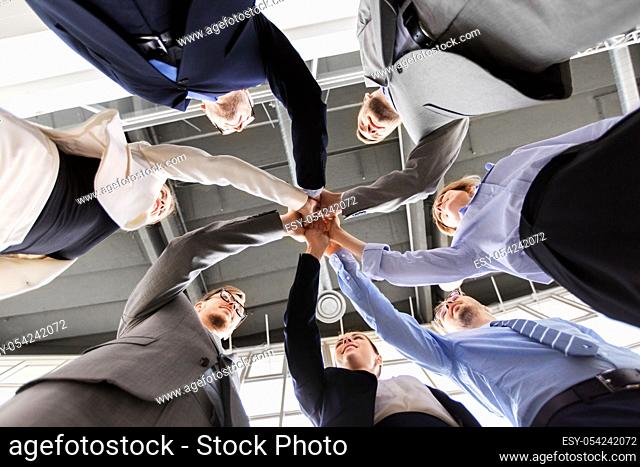 business people making high five at office