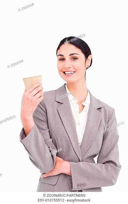 Smiling businesswoman with coffee in a paper cup