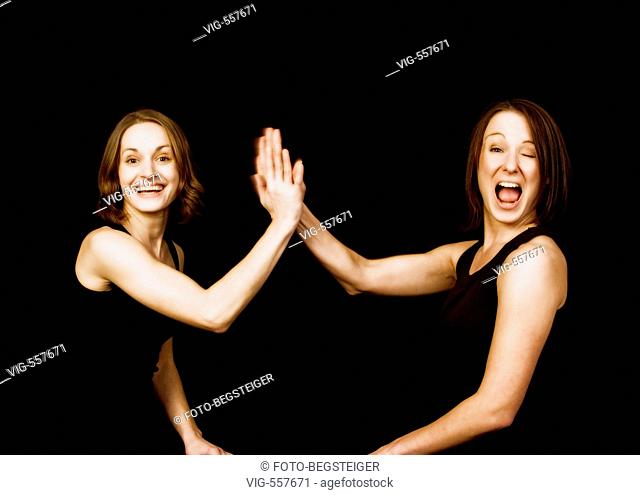 two women gives high five. - 13/11/2007