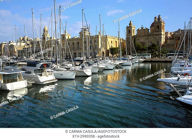 gondolas and boats in the canal of Birgu, Three Cities. Valletta, Malta