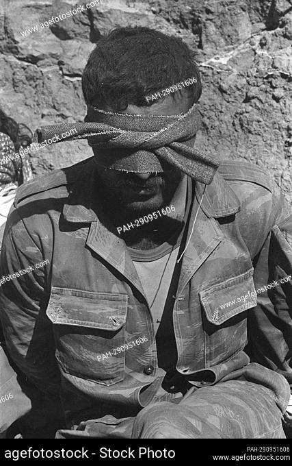 Syrian prisoner, Syrian Army soldier tied blindfolded, sits on ground, during Yom Kippur War, The Yom Kippur War between Israel and the Arab states of Egypt