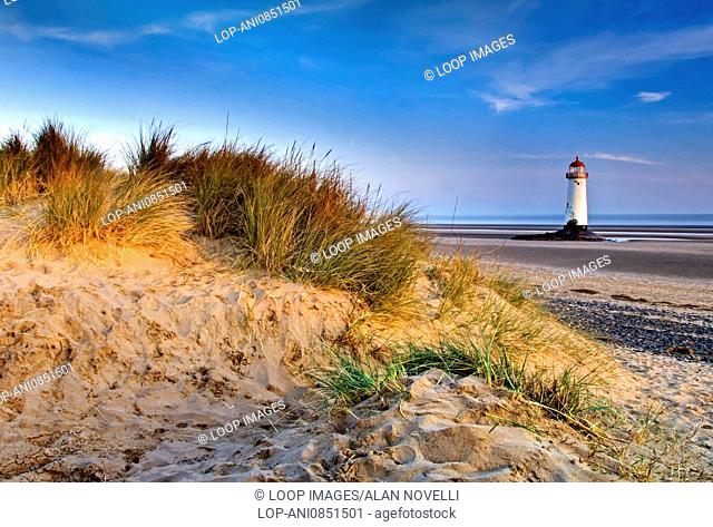 Talacre lighthouse from Talacre sand dunes at sunrise on the North Wales coast