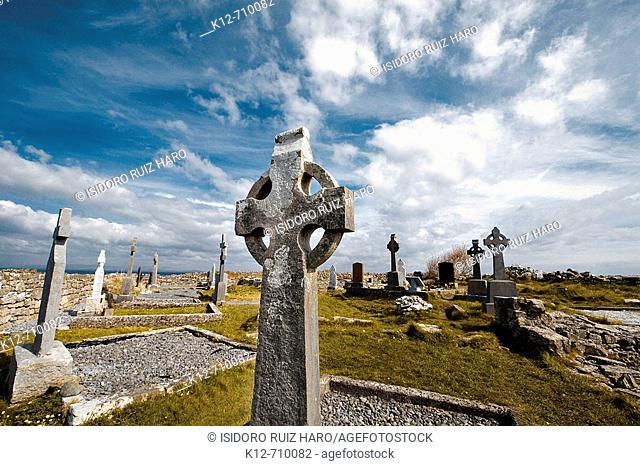 Celtic cross in Na Seacht dTeampaill (Seven Curches) graveyard celtic remains. Inishmore, biggest of Aran Islands. Galway Co. Ireland
