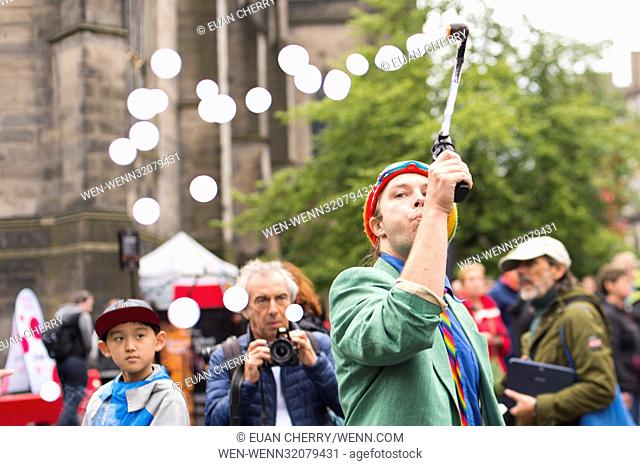 Street performers and musicians fill the Royal Mile as the Fringe festival officially kicks off in Edinburgh. Where: Edinburgh