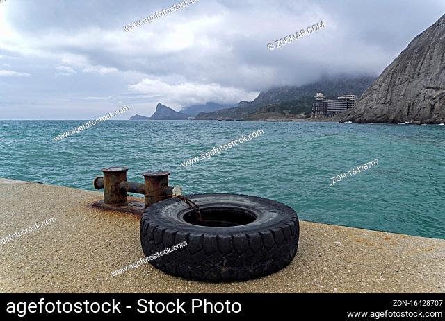 View from the pier from Sudak towards the Novyy Svet, Crimea. Cloudy day, spring, early April