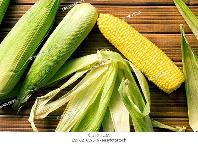 sweet corn on wooden table