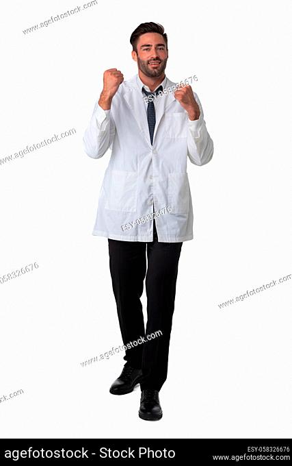 Young male medical doctor with stethoscope holding fists isolated on white background full length studio portrait
