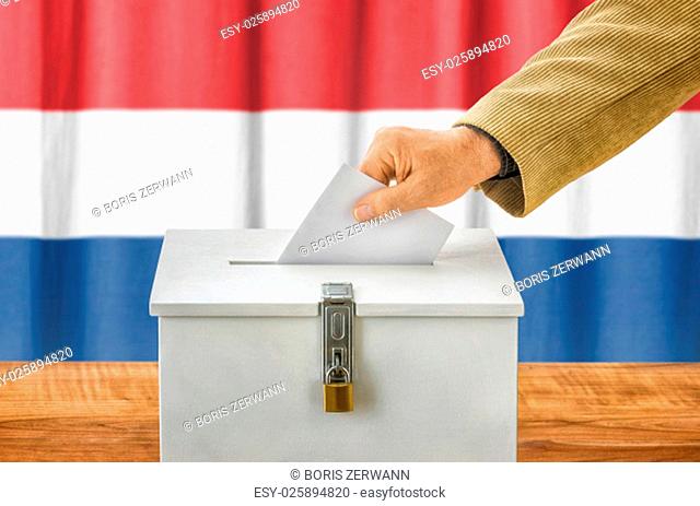 man putting ballot in ballot box - netherlands