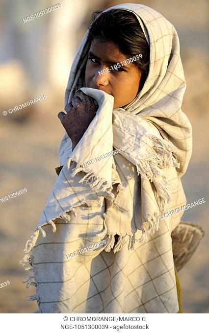 Indian girl wrapped with blanket