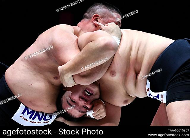 RUSSIA, MOSCOW - DECEMBER 10, 2023: Athletes Sulde Dongak of Kyrgyzstan and Badral Baasandorj of Mongolia wrestle as part of the Sumo Commonwealth Cup at the...