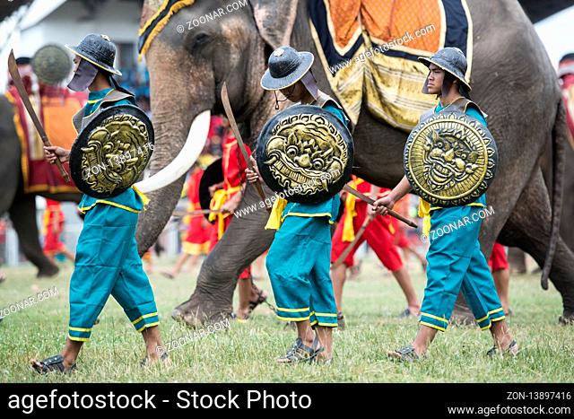 the historical warriors at the Elaphant Show in the Stadium at the traditional Elephant Round Up Festival in the city of Surin in Isan in Thailand