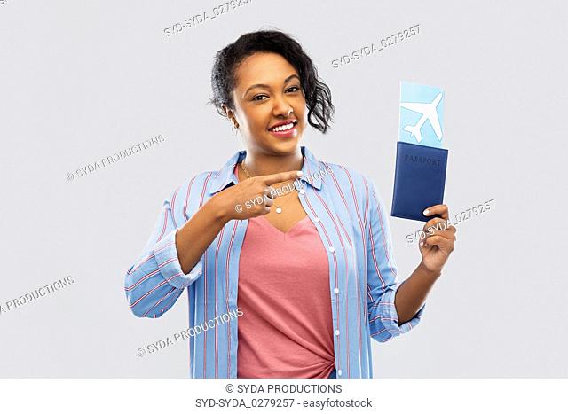 african woman with passport and air ticket
