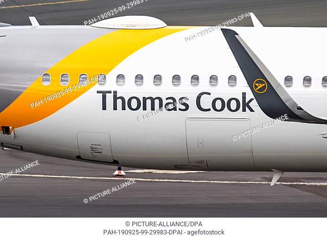 25 September 2019, North Rhine-Westphalia, Duesseldorf: An aircraft of the airline Thomas Cook rolls over the apron at Düsseldorf Airport