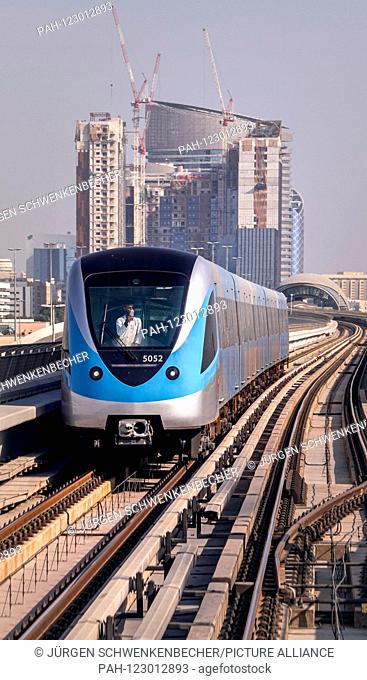 A metro train runs fully automatically between skyscrapers in Dubai. The metro has been part of the city since 2009, when the first section went into operation...