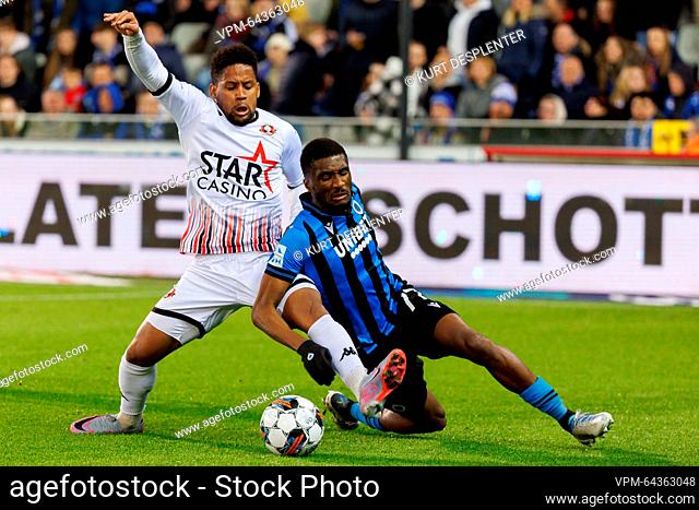 Seraing's Vagner Mvoue and Club's Clinton Mata fight for the ball during a soccer match between Club Brugge KV and RFC Seraing, Friday 07 April 2023 in Brugge