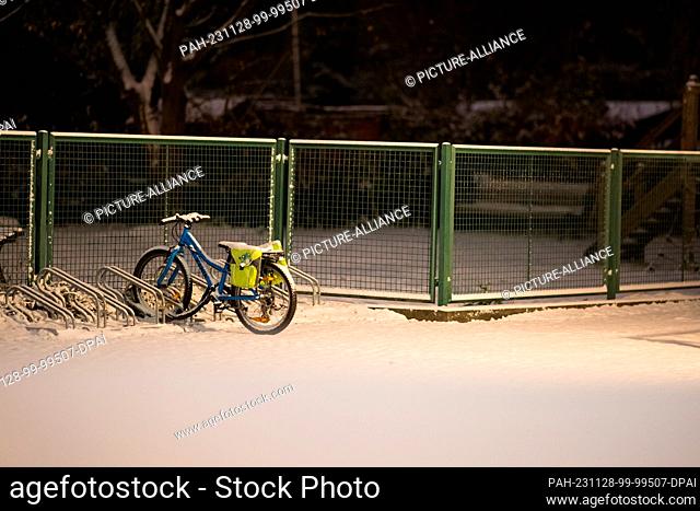 28 November 2023, Berlin: A child's bicycle stands on the grounds of a kindergarten that is closed due to a strike. The GEW trade union is calling on all public...