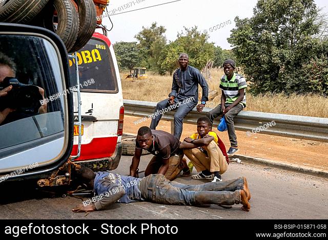 Public transport minibus breakdown on a Burkina Faso road