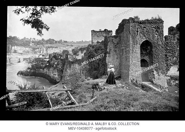 Edwardian woman at Chepstow Castle, overlooking the River Wye at Gwent (formerly Monmouthshire), Wales. Building began in the 11th century