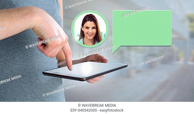 Hand using tablet with chat bubble messaging profile
