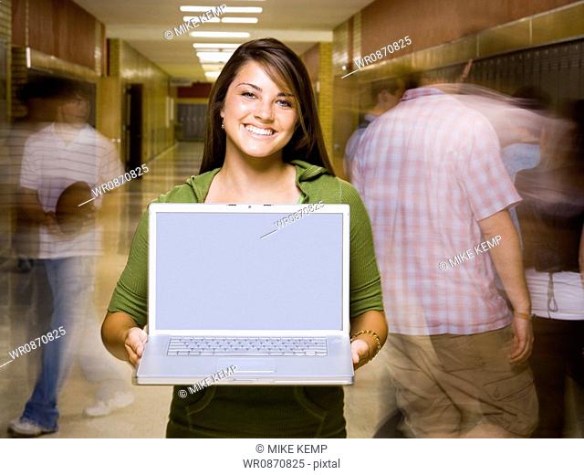High School girl at school with a notebook computer