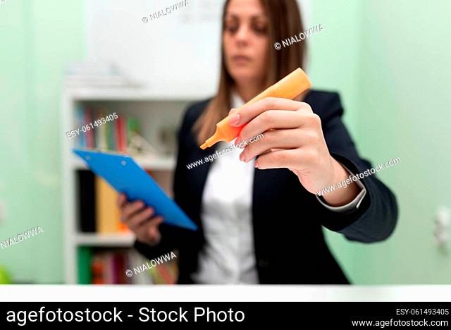 Woman Holding Clipboard In One Hand And Marker With Other Pointing New Idea