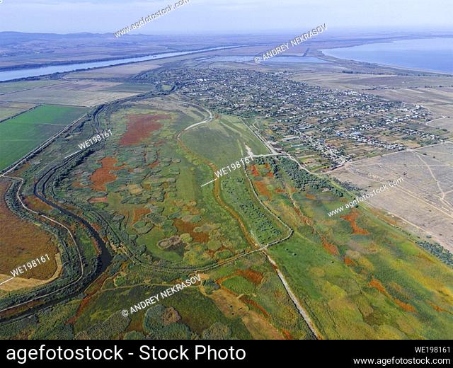 Aerial view on flood-meadow in Eco park Kartal, Orlovka village and Kartal lake. Kartal Eco Park, Orlovka village, Reni raion, Odessa oblast, Ukraine