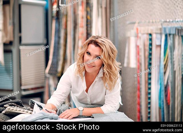 Interior designer woman at work. Design and interior decoration fabric