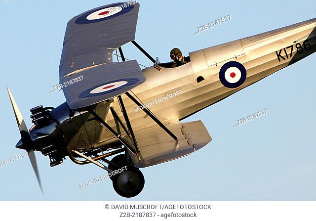 1930's RAF Hawker Hind biplane fighter aircraft at a Shuttleworth Collection air display at Old Warden airfield, Bedfordshire, UK