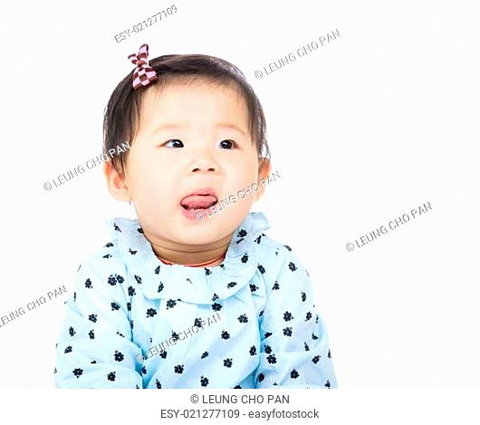 Asian baby girl lick sticking out