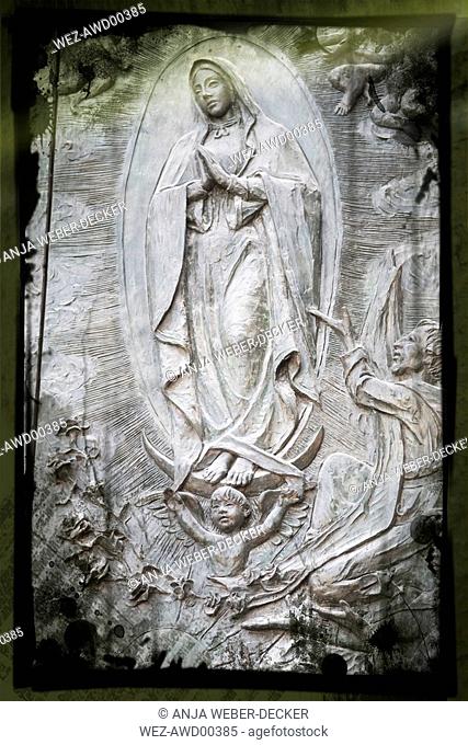 Spain, Madrid, Stone carving of Virgin Mary