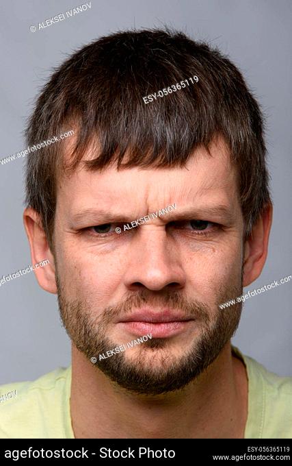 Closeup portrait of an anxious man of European appearance