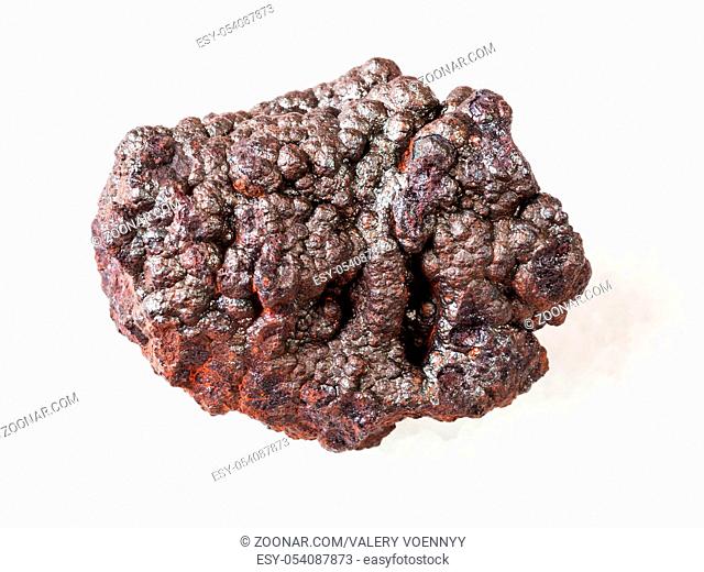 macro shooting of natural rock specimen - rough Goethite stone (brown iron) on white marble background from Tharsis, Spain