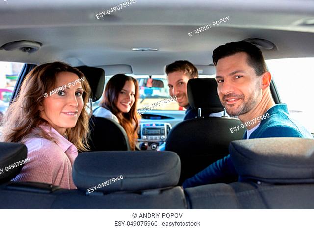 Smiling People Sitting Inside The Ride Sharing Car