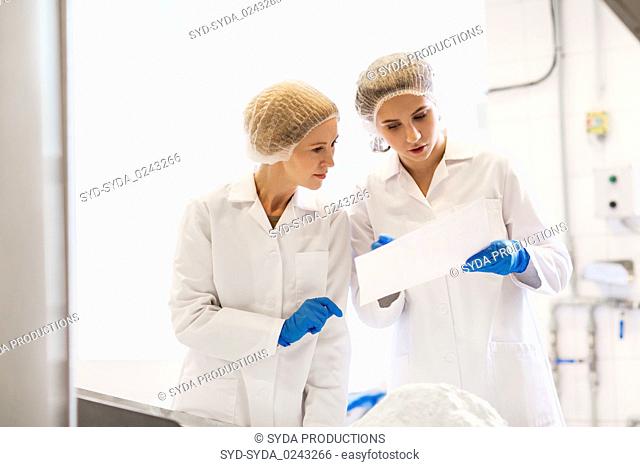 women technologists working at ice cream factory
