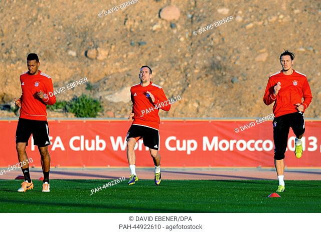 Bayern Munich's Jerome Boateng (L-R), Franck Ribery and Daniel van Buyten practice during a training session in Marrakesh, Morocco, 20 December 2013