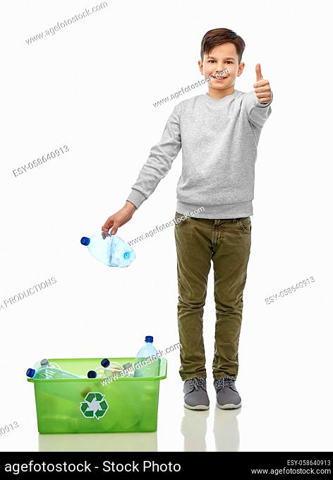 smiling boy sorting plastic waste