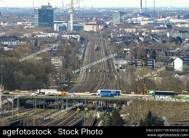 17 March 2023, North Rhine-Westphalia, Duisburg: The 8-lane rail line at the Kaiserberg interchange (aerial photo taken with a drone)