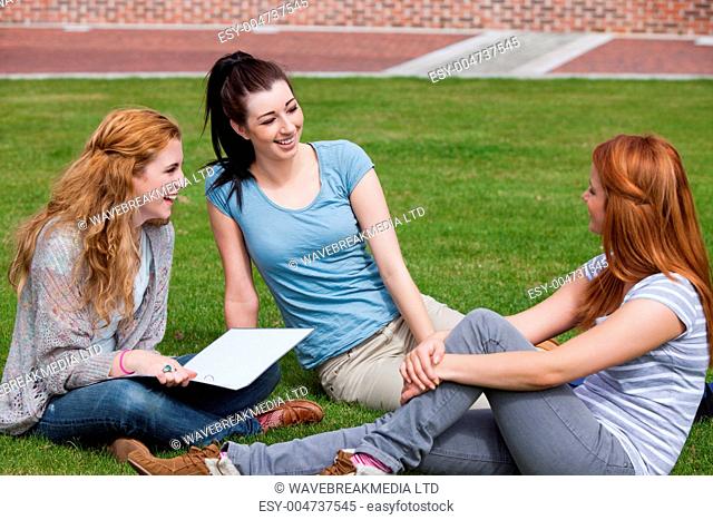 Happy students sitting together