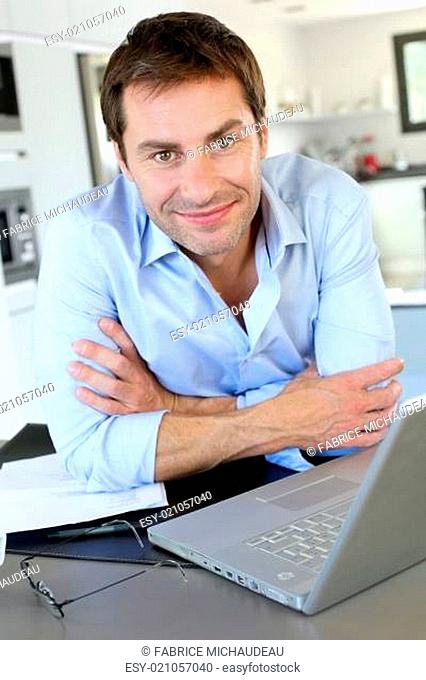 Portrait of businessman working from home