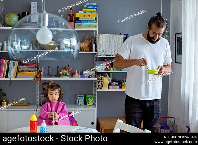 Father with daughter at home