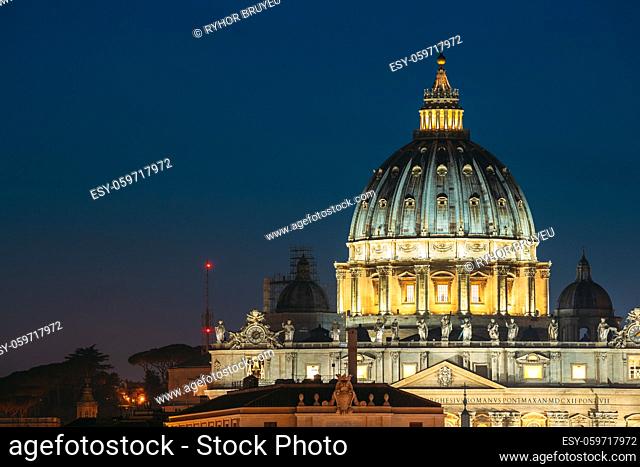 Rome, Italy. Close Up View Dome Of Papal Basilica Of St. Peter In Vatican In Evening Night Illuminations