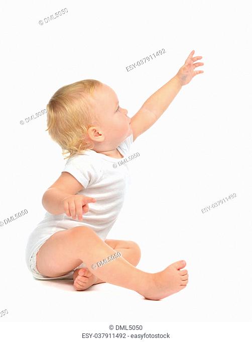 Infant child baby toddler sitting raise hand up pointing finger isolated on a white background