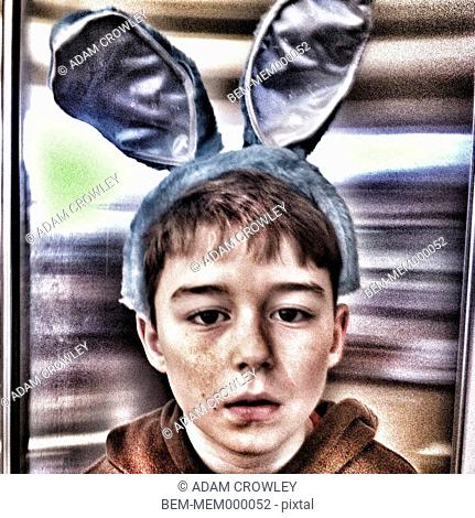 Caucasian boy in rabbit ears