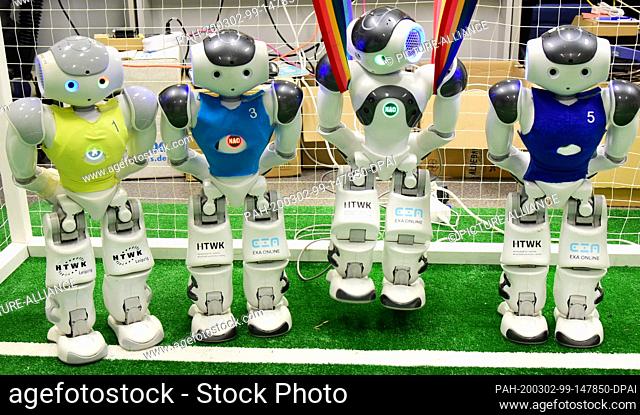 20 February 2020, Saxony, Leipzig: In the robot laboratory of the Nao Team of the University of Applied Sciences (HTWK), three robot footballers are playing a...