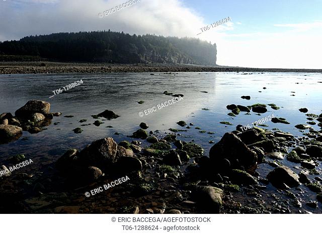 Upper Salmon river at outgoing tide and sunrise, Bay of Fundy shores at Alma, New Brunswick, Canada