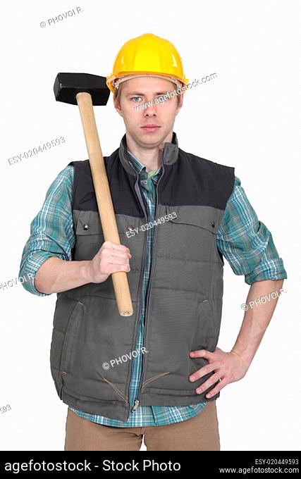 Builder stood with sledge-hammer