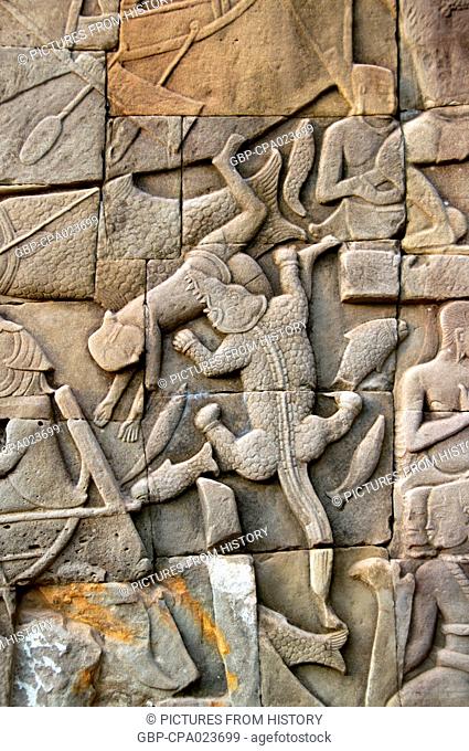 Cambodia: A crocodile attacking a Cham warrior on the Tonle Sap, bas-relief Southern Wall, The Bayon, Angkor Thom, Angkor