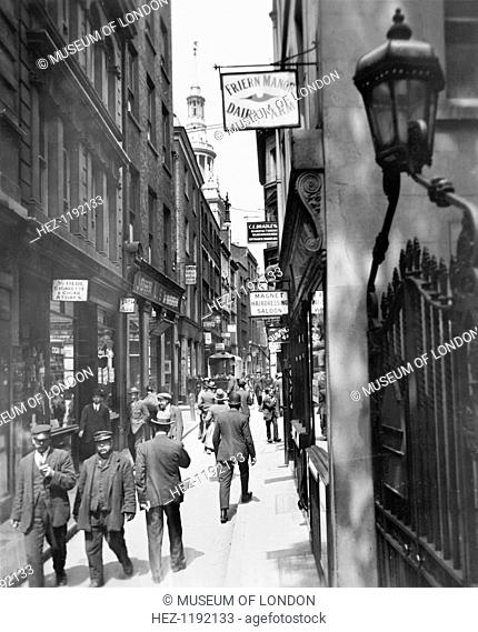 Bow Lane looking north, City of London, c1920s. Reid, an amateur photographer of independent means, began an ambitious project to record