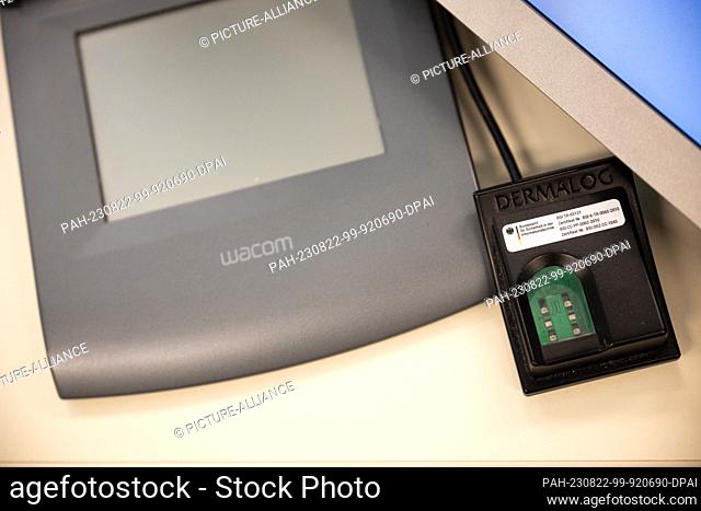 22 August 2023, Berlin: A fingerprint scanner and digital signature pad are located in the Education Citizenship Office. Photo: Sebastian Christoph Gollnow/dpa